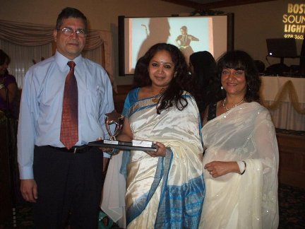Neha receiving excellence award